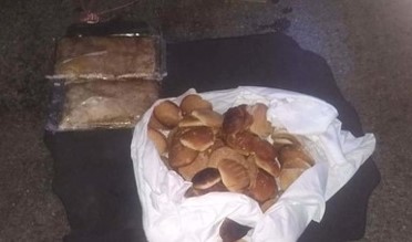 Localiza Guardia Nacional dos paquetes de aparente Crystal ocultos con piezas de pan dulce